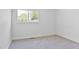 Cozy bedroom with carpet flooring and a sun-filled window view at 6579 Ingalls St, Arvada, CO 80003