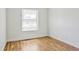 Bedroom featuring hardwood floors and natural light from the window at 6579 Ingalls St, Arvada, CO 80003
