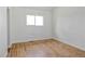 This bright bedroom offers new floors and a window with views at 6579 Ingalls St, Arvada, CO 80003