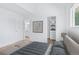 Bright bedroom boasts neutral decor, walk-in closet, and ensuite bathroom at 6579 Ingalls St, Arvada, CO 80003