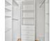 Custom closet includes shelving and drawers for optimal storage at 6579 Ingalls St, Arvada, CO 80003