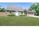Attractive single-Gathering home with stone accents, green lawn, and an attached garage at 6579 Ingalls St, Arvada, CO 80003