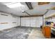 Spacious garage with overhead door and shelving at 6579 Ingalls St, Arvada, CO 80003