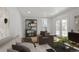 Inviting living room featuring comfortable seating, hardwood flooring, and stylish decor at 6579 Ingalls St, Arvada, CO 80003