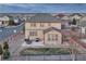 Overhead angle highlighting the home's backyard, stone landscaping, and outdoor dining area at 7310 Blue Water Dr, Castle Rock, CO 80108