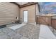 Back entrance featuring a private entrance and low maintenance yard at 7310 Blue Water Dr, Castle Rock, CO 80108