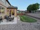 Home back yard features a patio with table and chairs, and built-in garden beds at 7310 Blue Water Dr, Castle Rock, CO 80108