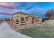 House backyard with lawn, stone, and wooden fence at 7310 Blue Water Dr, Castle Rock, CO 80108