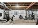 Unfinished basement area is set up as a home gym with workout equipment at 7310 Blue Water Dr, Castle Rock, CO 80108