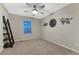 Neutrally decorated bedroom featuring a ceiling fan and animal-themed decor at 7310 Blue Water Dr, Castle Rock, CO 80108