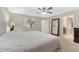 Inviting bedroom suite with soft carpet and doorways that lead to an ensuite bathroom at 7310 Blue Water Dr, Castle Rock, CO 80108