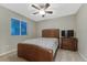Inviting bedroom with a cozy bed, ambient lighting, and a serene window view at 7310 Blue Water Dr, Castle Rock, CO 80108