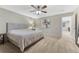 Comfortable bedroom featuring a queen-sized bed, soft carpet, and view into connecting space at 7310 Blue Water Dr, Castle Rock, CO 80108