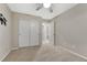 Carpeted bedroom with closet and neutral walls for a cozy and adaptable living space at 7310 Blue Water Dr, Castle Rock, CO 80108