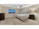 Inviting bedroom with plush carpet, a queen-sized bed, and coordinated nightstands with ample natural light at 7310 Blue Water Dr, Castle Rock, CO 80108