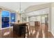 Spacious dining area with outdoor views, wood floors, backyard access, and eat-in bar at 7310 Blue Water Dr, Castle Rock, CO 80108
