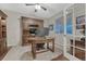 Elegant home office with custom built-ins, hardwood floors, and a comfortable workspace at 7310 Blue Water Dr, Castle Rock, CO 80108