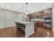 Lovely kitchen featuring stainless steel appliances, granite countertops, and a convenient center island at 7310 Blue Water Dr, Castle Rock, CO 80108