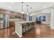 Spacious kitchen featuring a granite island with seating, stainless steel appliances, and ample cabinet space at 7310 Blue Water Dr, Castle Rock, CO 80108