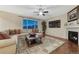 Inviting living room with comfortable seating, fireplace, and stylish decor at 7310 Blue Water Dr, Castle Rock, CO 80108