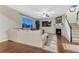 Bright living room features a fireplace, neutral palette, and lots of natural light at 7310 Blue Water Dr, Castle Rock, CO 80108