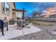 Backyard patio with outdoor seating and a grill, perfect for enjoying outdoor meals and gatherings at 7310 Blue Water Dr, Castle Rock, CO 80108