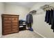 Bright walk-in closet with a dresser and shelving for organized storage solutions at 7310 Blue Water Dr, Castle Rock, CO 80108