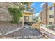 Private backyard with a patio, wooden retaining wall, and potential for outdoor living at 12504 E Cornell Ave # 103, Aurora, CO 80014