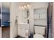 Well-lit bathroom with a sleek vanity, modern fixtures, and decorative shower curtain at 12504 E Cornell Ave # 103, Aurora, CO 80014
