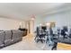 Open floor plan living room leads to a connected kitchen and office space at 12504 E Cornell Ave # 103, Aurora, CO 80014