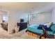 Spacious main bedroom featuring a large bed, dresser, closet, and lots of natural light at 12504 E Cornell Ave # 103, Aurora, CO 80014