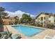 Community pool with ample seating, landscaped surroundings, and inviting atmosphere at 12504 E Cornell Ave # 103, Aurora, CO 80014