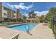 Community pool area with clear blue water, lounge chairs, and well-maintained surroundings at 12504 E Cornell Ave # 103, Aurora, CO 80014