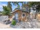 Quaint backyard shed with charming details surrounded by a rock garden at 3272 S Joplin Ct, Aurora, CO 80013