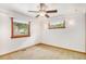 Bright bedroom featuring a ceiling fan and three windows with wooded trim at 3272 S Joplin Ct, Aurora, CO 80013