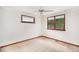 Bright bedroom featuring a ceiling fan and windows with wooded trim at 3272 S Joplin Ct, Aurora, CO 80013