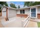 Charming single-story home with accessible ramp to front door and manicured landscaping at 3272 S Joplin Ct, Aurora, CO 80013