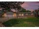 Well-maintained ranch home with a manicured lawn, pretty flower beds, and an attached garage at 3272 S Joplin Ct, Aurora, CO 80013