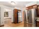Spacious kitchen with stainless steel appliances and natural wood cabinetry at 3272 S Joplin Ct, Aurora, CO 80013