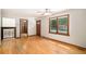 Inviting living room with hardwood floors, classic trim, and access to other rooms at 3272 S Joplin Ct, Aurora, CO 80013