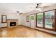 Comfortable living room featuring a fireplace, hardwood floors, and access to backyard views at 3272 S Joplin Ct, Aurora, CO 80013