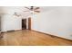 Spacious living room with hardwood floors, ceiling fans, and neutral color scheme at 3272 S Joplin Ct, Aurora, CO 80013