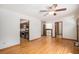 Open-concept space with hardwood floors providing seamless flow from living area to kitchen at 3272 S Joplin Ct, Aurora, CO 80013