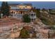 Expansive backyard with tiered garden, gazebo, outdoor kitchen and lovely views of the surrounding landscape at 2874 Cliff View Ct, Castle Rock, CO 80104