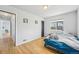 Bedroom with hardwood floors, natural light, and a neutral color scheme at 1857 W Tennessee Ave, Denver, CO 80223