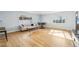 Open-concept living space with hardwood floors and neutral paint at 1857 W Tennessee Ave, Denver, CO 80223