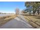 Paved path running alongside the lake, perfect for walking, jogging, or biking at 1857 W Tennessee Ave, Denver, CO 80223