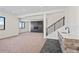 Spacious basement featuring neutral carpet, modern fireplace, and wet bar at 5741 Doc Bar Circle, Larkspur, CO 80118