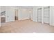 Spacious basement featuring neutral carpet, a wet bar, and lots of closet space at 5741 Doc Bar Circle, Larkspur, CO 80118