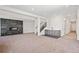 Finished basement with fireplace, wet bar, carpeted floors, and neutral walls at 5741 Doc Bar Circle, Larkspur, CO 80118